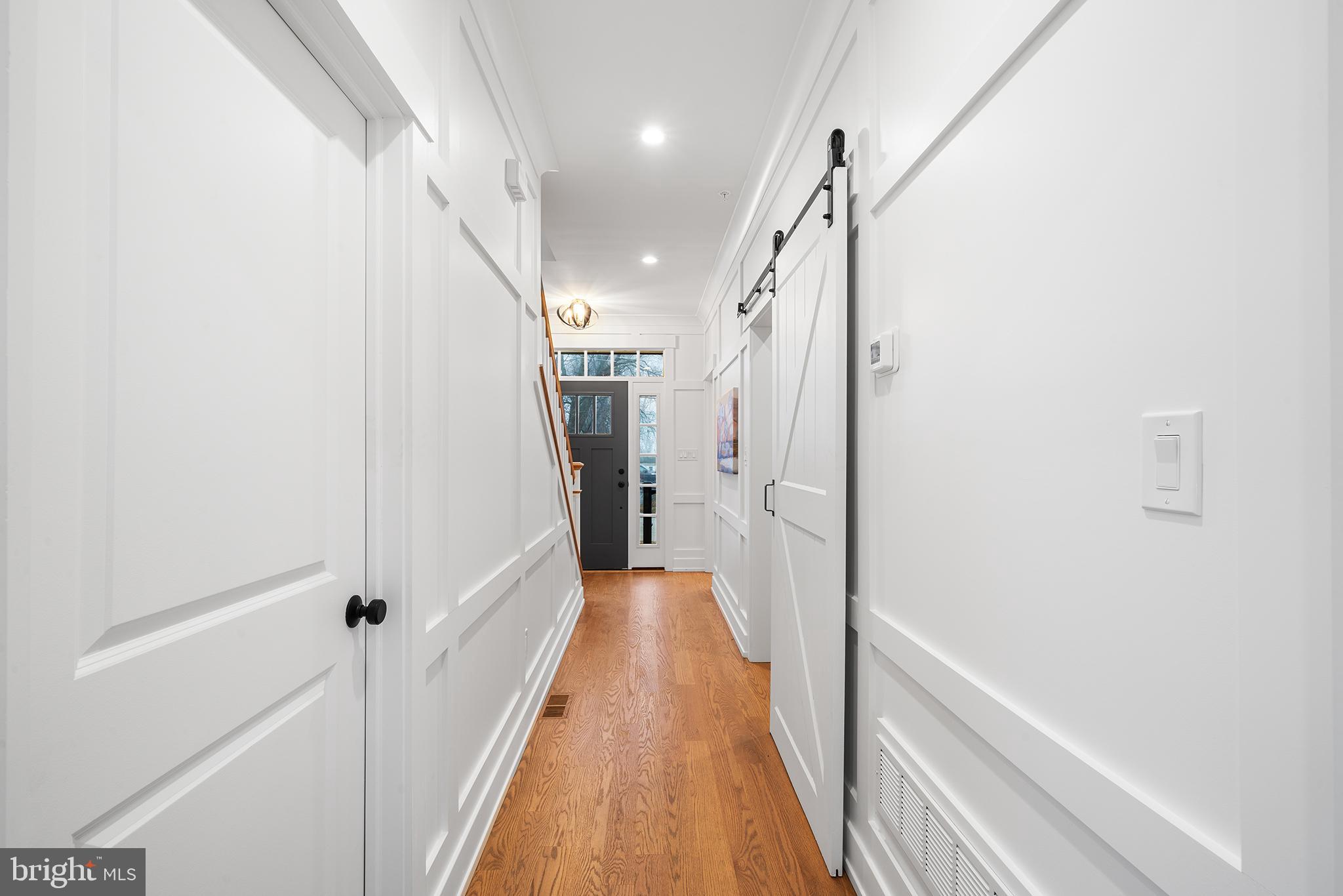 218 Hendricks Avenue Exton, PA 19341 - Photo 5 of 33 a view of a hallway with wooden floor and staircase
