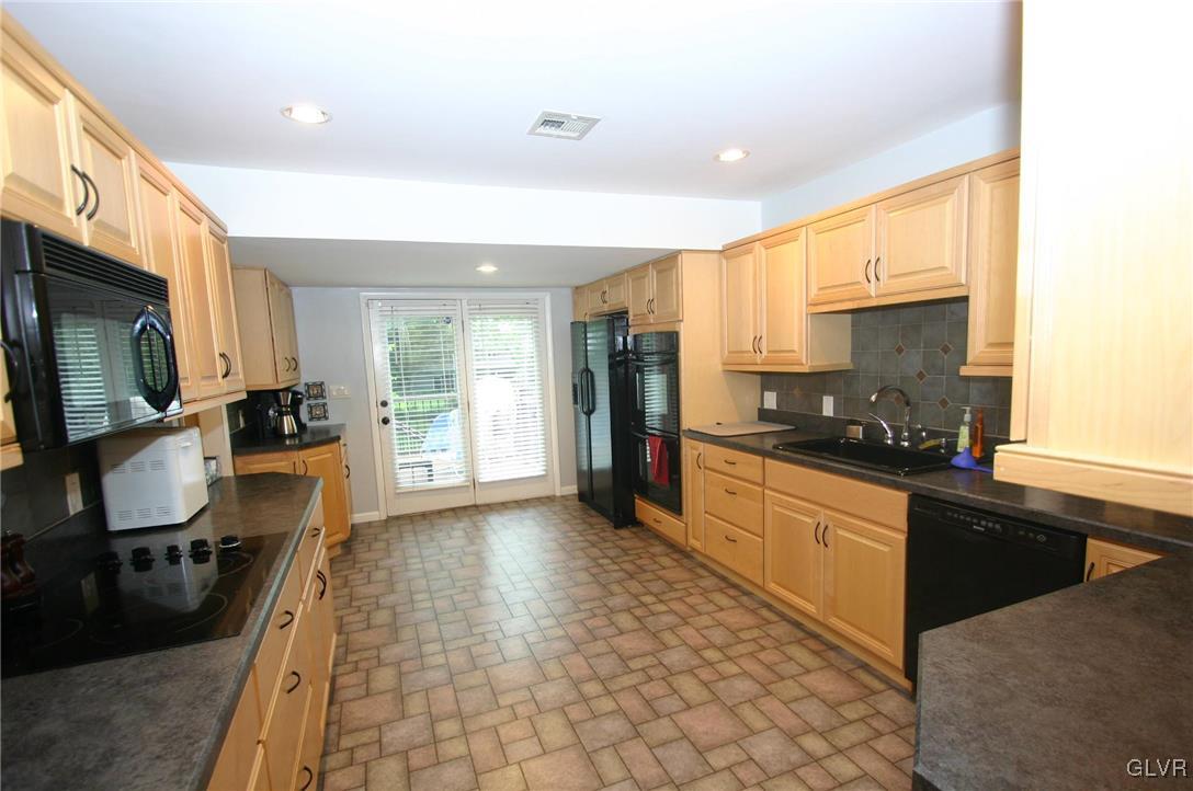 4210 Wellesley Road Bethlehem, PA 18017 - Photo 11 of 44 Huge ultra modern kitchen, leads to the elevated d