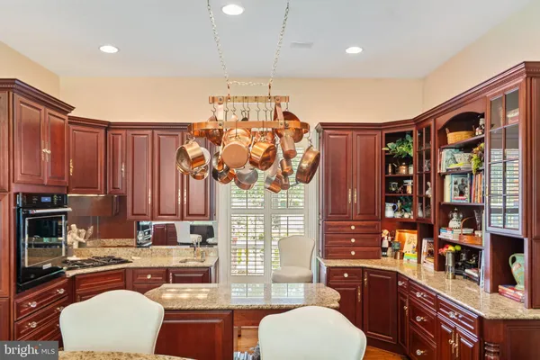 a kitchen with stainless steel appliances granite countertop a stove and a sink