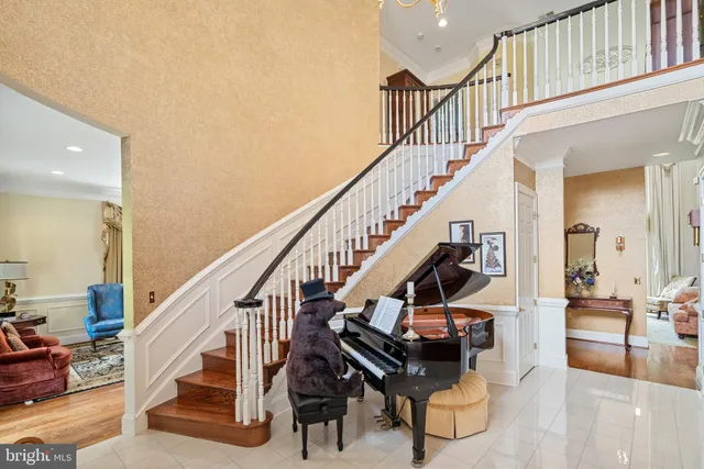 a living room with lots of furniture and a chandelier
