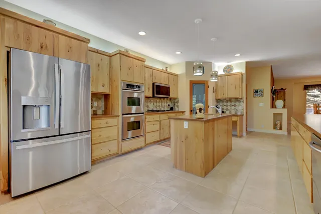 a bedroom with a bed and flat screen tv
