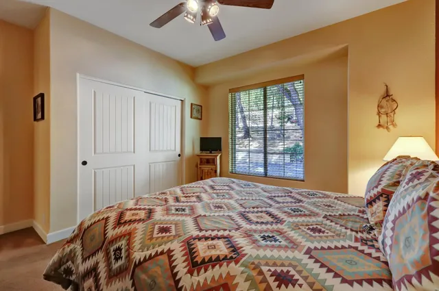 a room with gym equipment and a flat screen tv