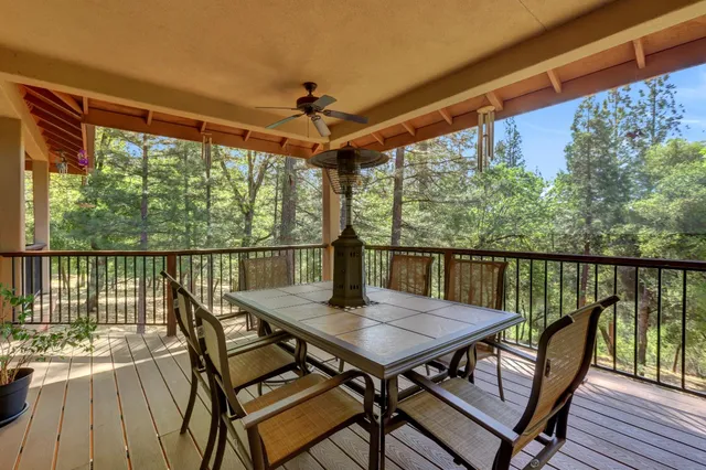 a backyard of a house with large trees