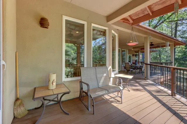 a view of a house with a yard and tree s