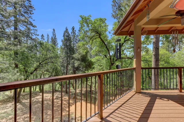 a view of a house with a tree in the background
