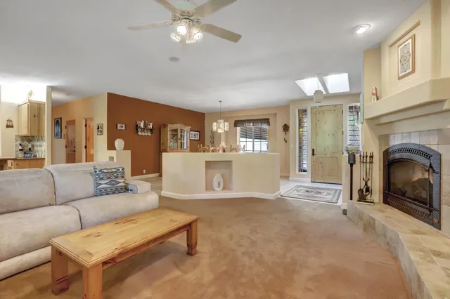 a living room with fireplace furniture and a flat screen tv