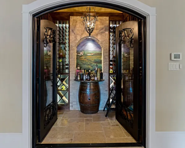 a kitchen with granite countertop a sink cabinets and stove top oven