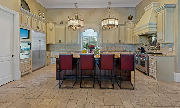a living room with furniture a bookshelf and a fireplace
