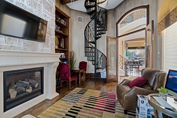 a view of a livingroom with furniture and a window