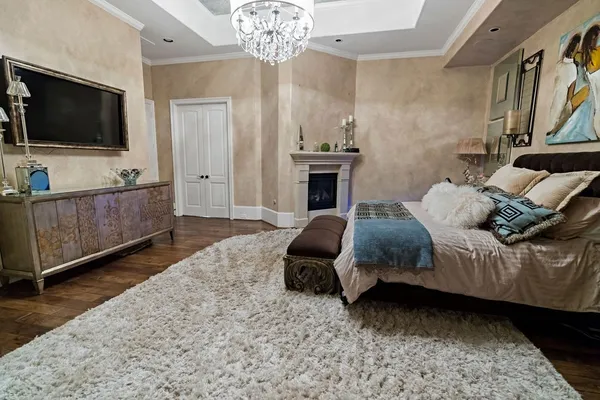 a living room with stainless steel appliances kitchen island granite countertop furniture a rug and a window