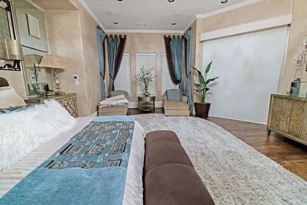 a spacious bathroom with a granite countertop sink a mirror and bathtub