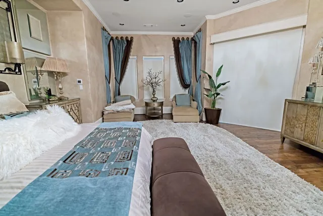 a spacious bathroom with a granite countertop sink a mirror and bathtub