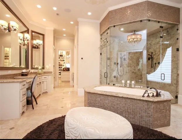 a living room with granite countertop furniture a fireplace and a chandelier