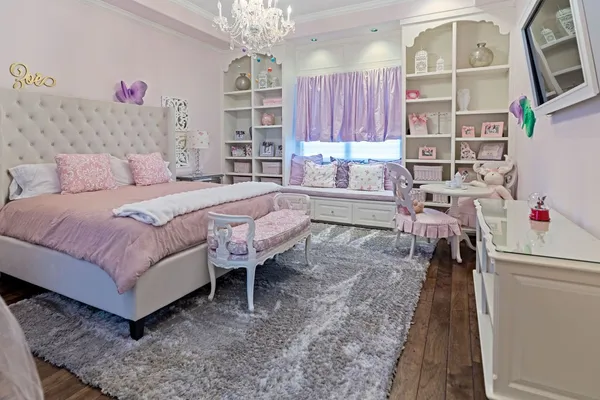 a room with pool table and windows