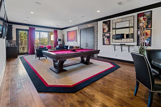 a living room with furniture and a floor to ceiling window