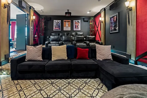 a living room with furniture a flat screen tv and a fireplace