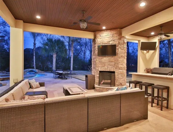 an aerial view of residential house with outdoor space and swimming pool