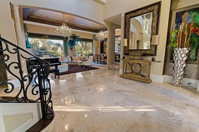 a view of a livingroom with furniture and a window