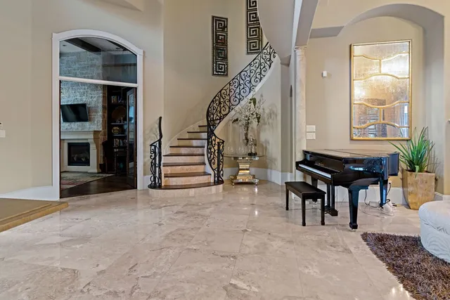 a view of entryway and hall with dining room