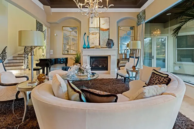 a living room with furniture fireplace and a fireplace