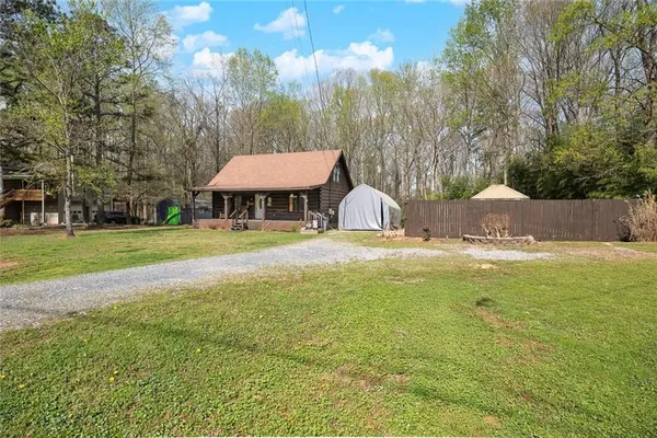a view of a swimming pool with an outdoor space and seating area