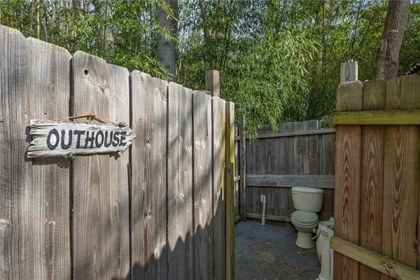 a backyard of a house with basket ball court