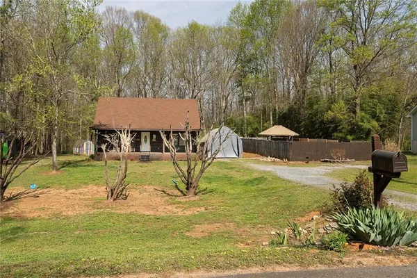 a view of a swimming pool with a patio