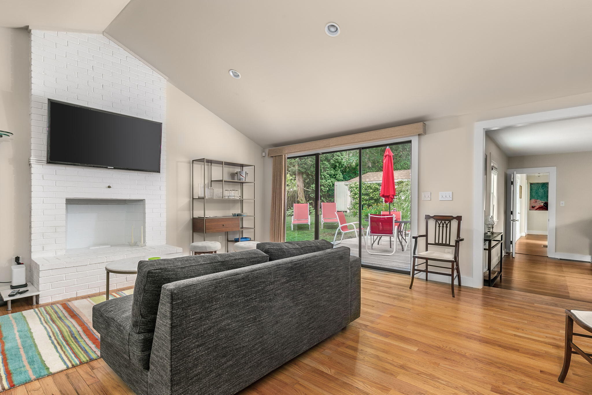 311 Main Street Centerville, MA 02632 - Photo 12 of 45 a living room with furniture and a flat screen tv