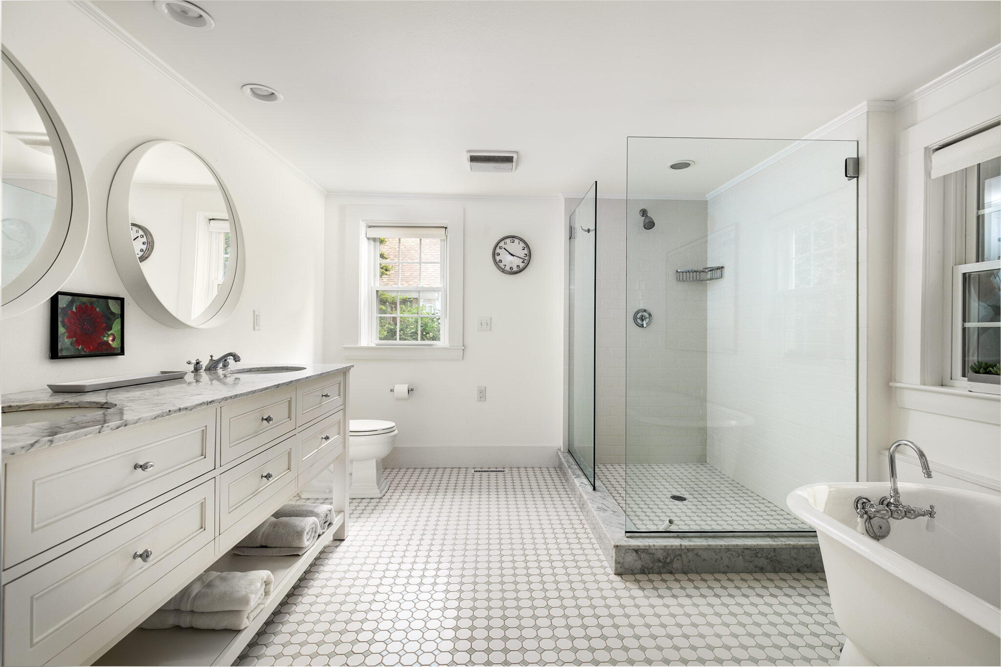 311 Main Street Centerville, MA 02632 - Photo 21 of 45 a bathroom with a double vanity sink mirror bathtub and toilet