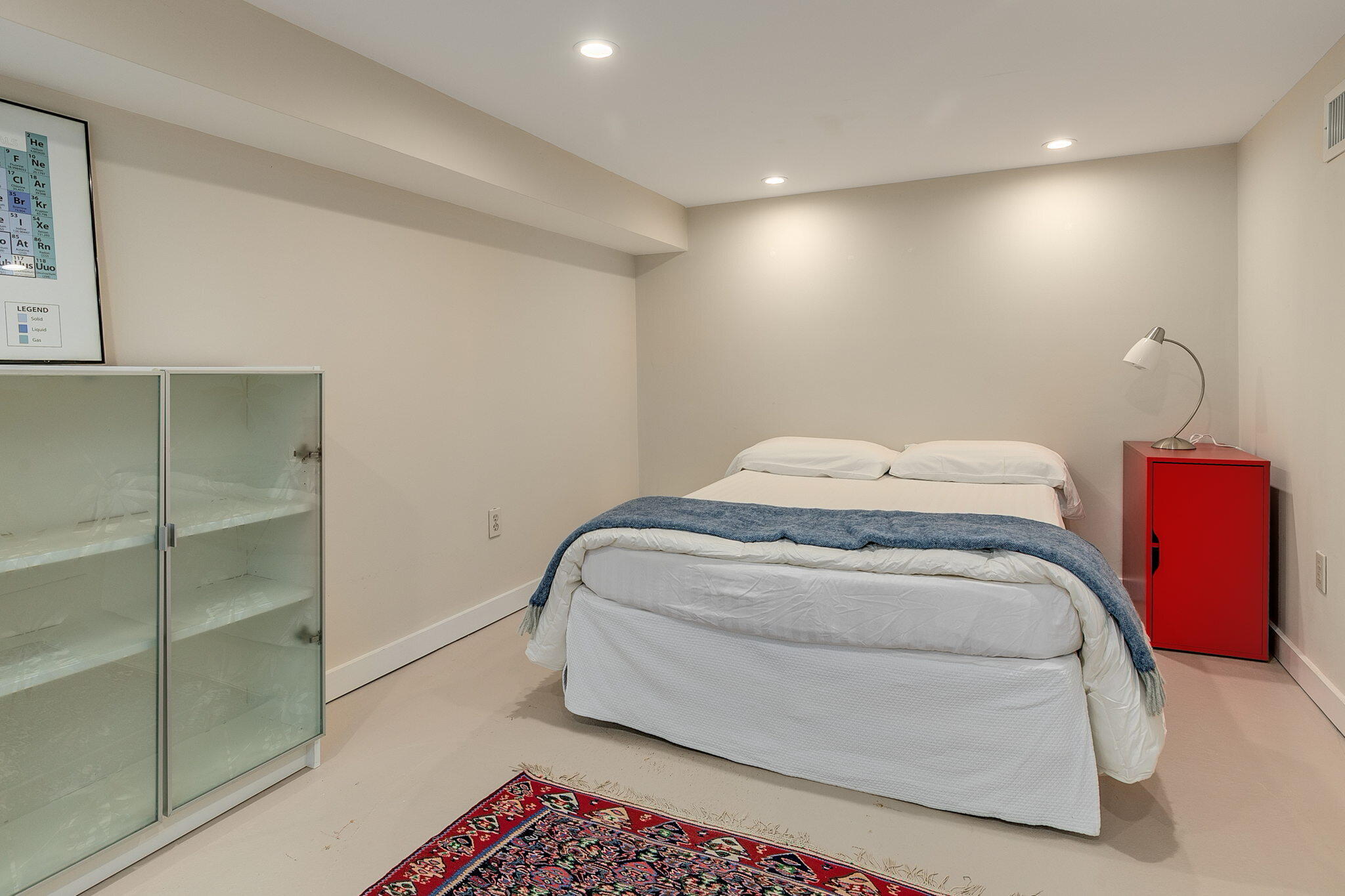 311 Main Street Centerville, MA 02632 - Photo 28 of 45 a bedroom with a bed and lamp