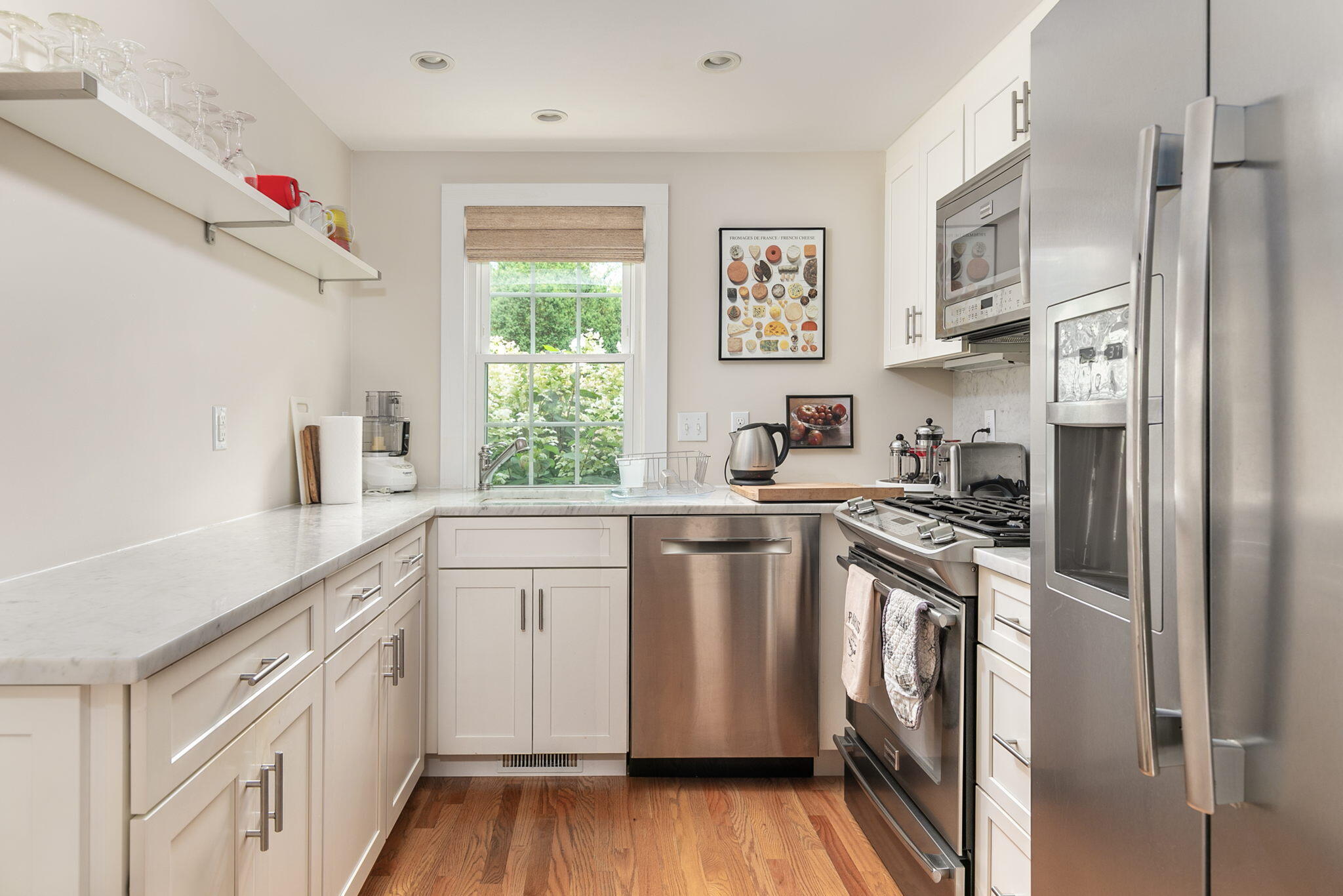 311 Main Street Centerville, MA 02632 - Photo 7 of 45 a kitchen with white cabinets and white appliances