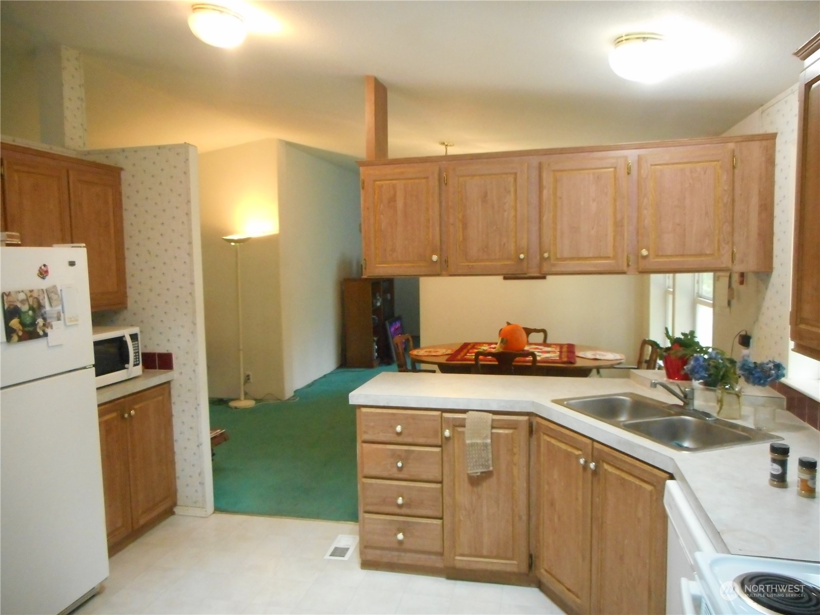 19817 Mac Road Granite Falls, WA 98252 - Photo 3 of 17 a kitchen with a sink a stove and cabinets