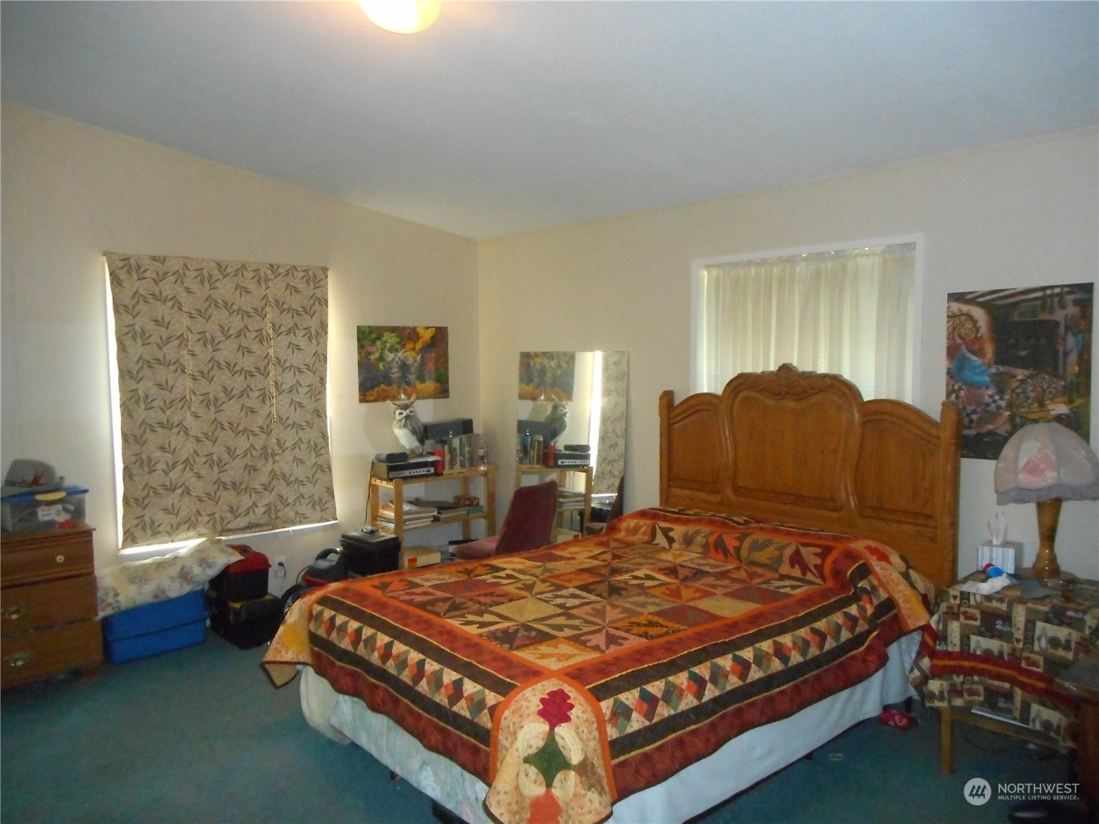 19817 Mac Road Granite Falls, WA 98252 - Photo 10 of 17 a bed sitting in a bedroom next to a window with dresser