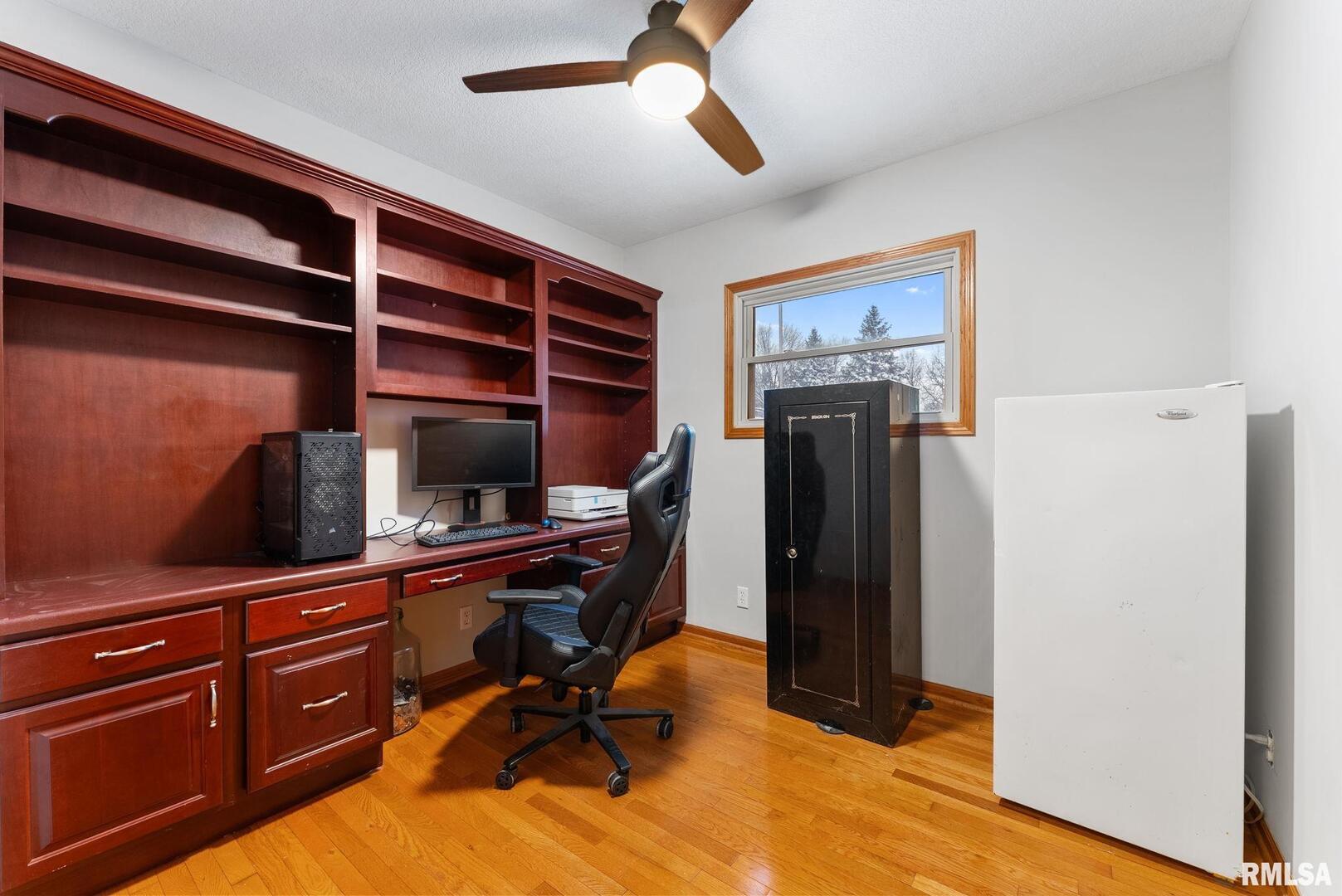 2530 37th Avenue Rock Island, IL 61201 - Photo 17 of 31 a view of a workspace with furniture and wooden floor