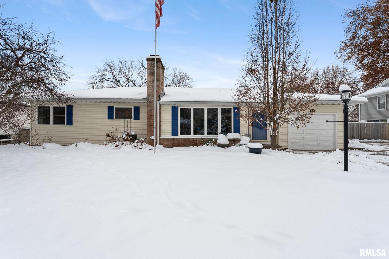 2530 37th Avenue Rock Island, IL 61201 - Photo 2 of 31 a view of a house with a yard covered in snow