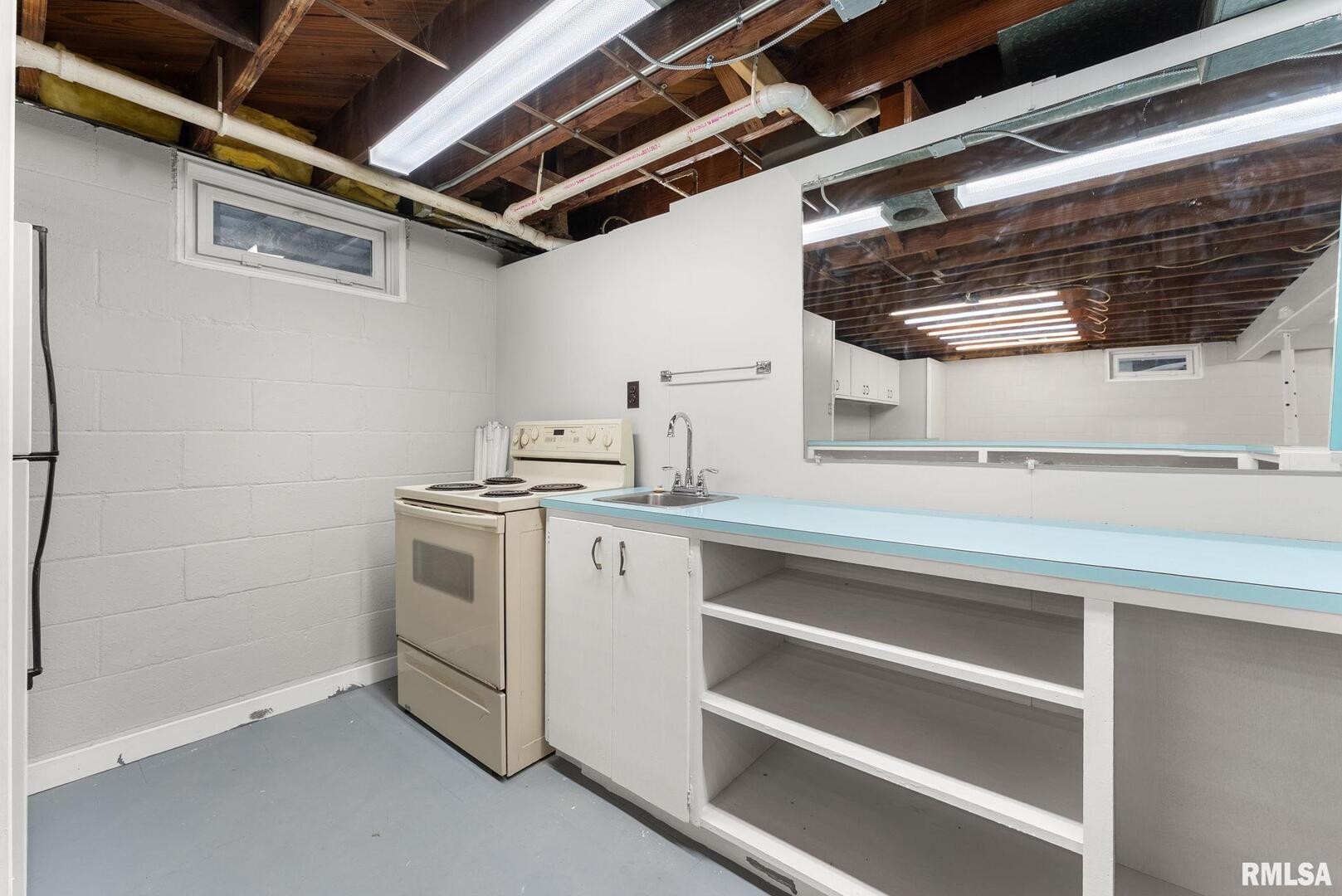 2530 37th Avenue Rock Island, IL 61201 - Photo 23 of 31 a utility room with sink dryer and washer