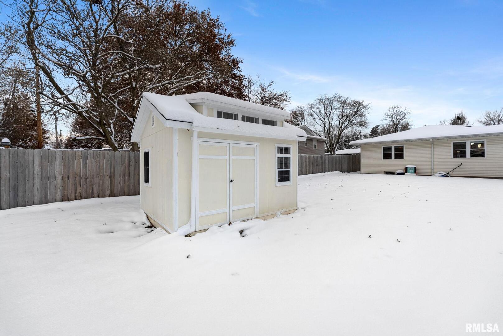 2530 37th Avenue Rock Island, IL 61201 - Photo 29 of 31 a white house that has a tree in front of it