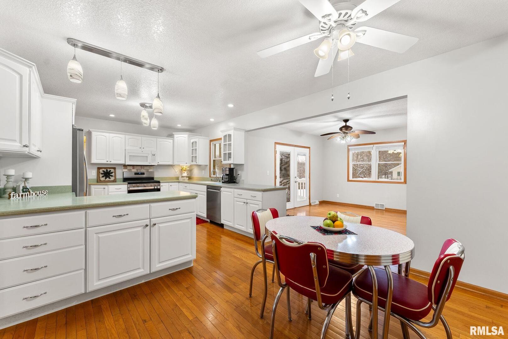 2530 37th Avenue Rock Island, IL 61201 - Photo 6 of 31 a open dining room with stainless steel appliances kitchen island granite countertop furniture and a kitchen view