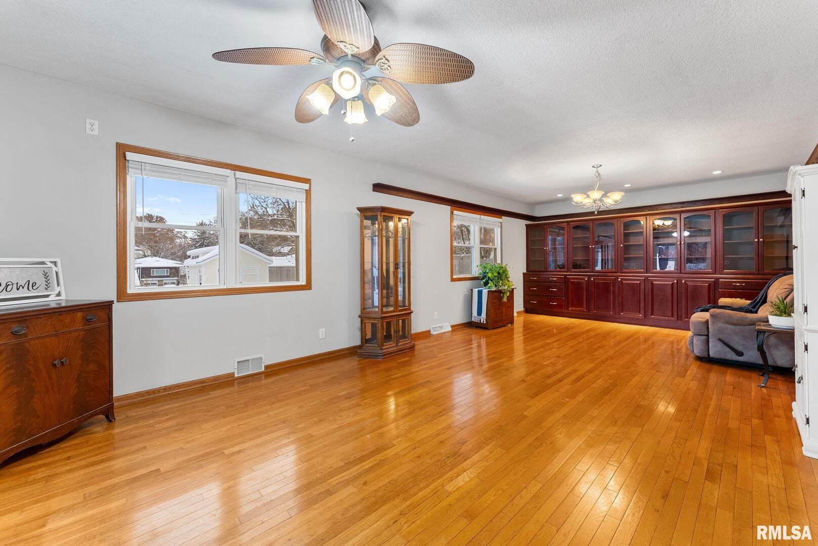 2530 37th Avenue Rock Island, IL 61201 - Photo 10 of 31 a view of an empty room with window and wooden floor