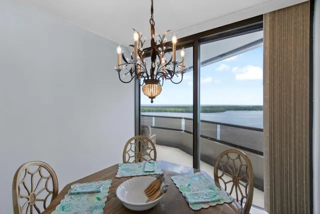 a table with a vase and flowers on it