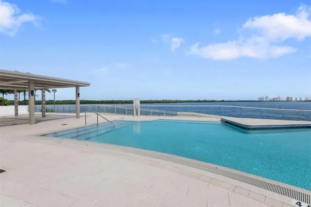 a view of swimming pool with outdoor space and seating area