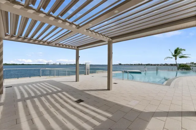 a view of a patio with furniture and garden