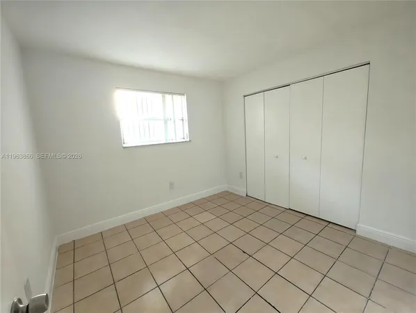 a view of an empty room and window