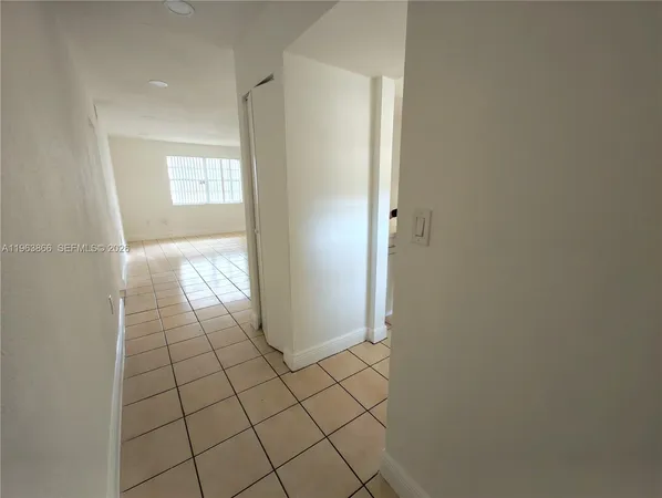 a view of an empty room and window