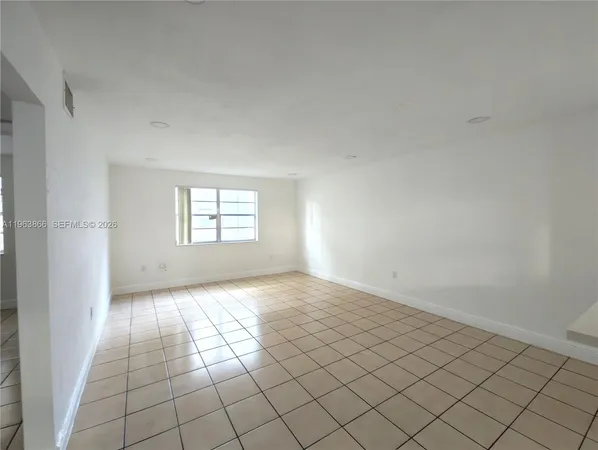 a view of an empty room and window