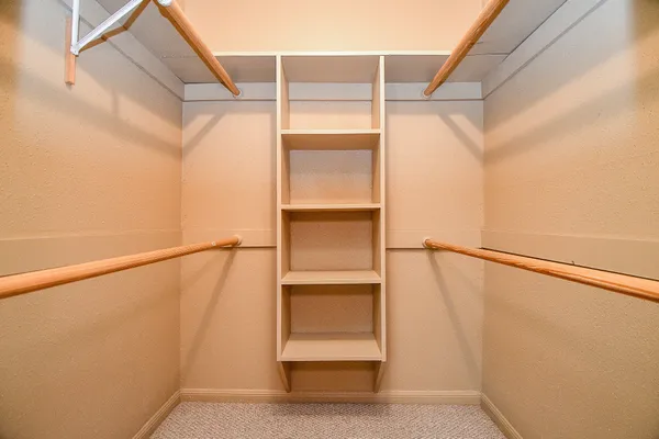 a view of an empty walk in closet