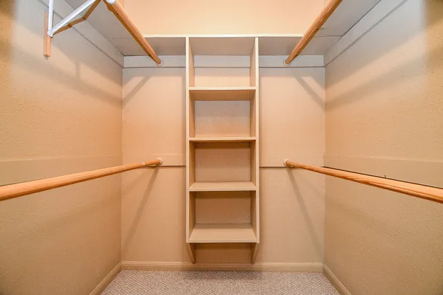 a view of an empty walk in closet