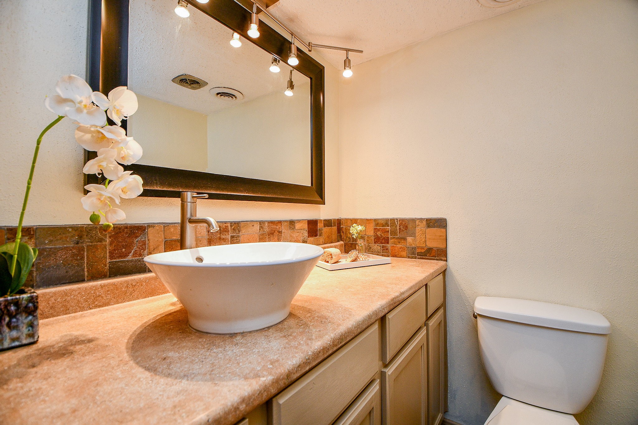 6533 Bayou Glen Road Houston, TX 77057 - Photo 16 of 19 a bathroom with a granite countertop sink and a mirror