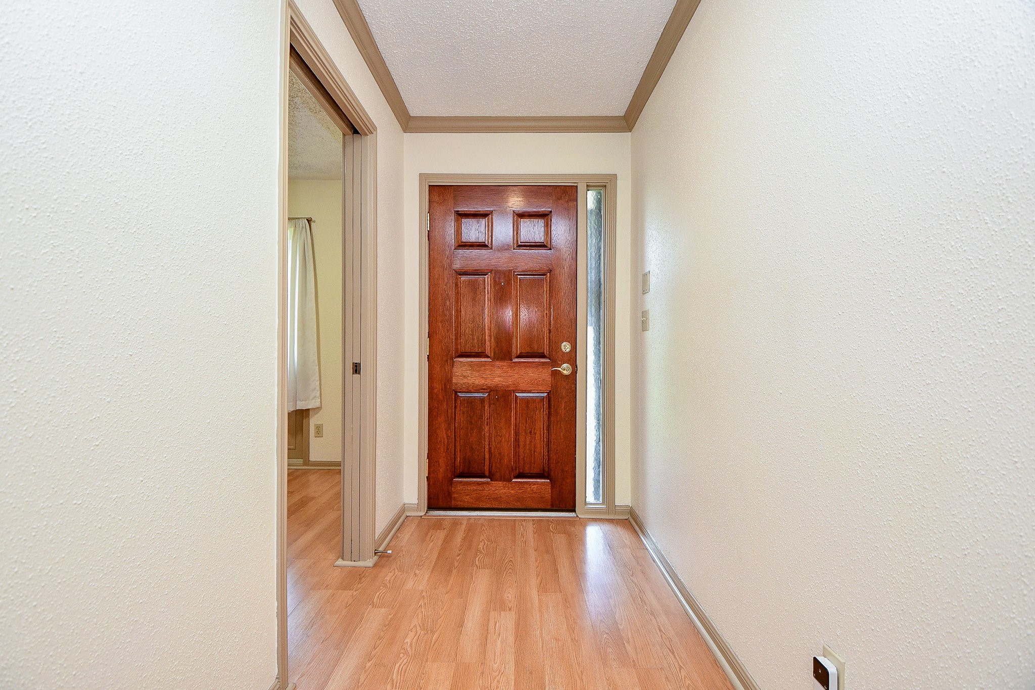 6533 Bayou Glen Road Houston, TX 77057 - Photo 2 of 19 a view of a hallway with wooden floor