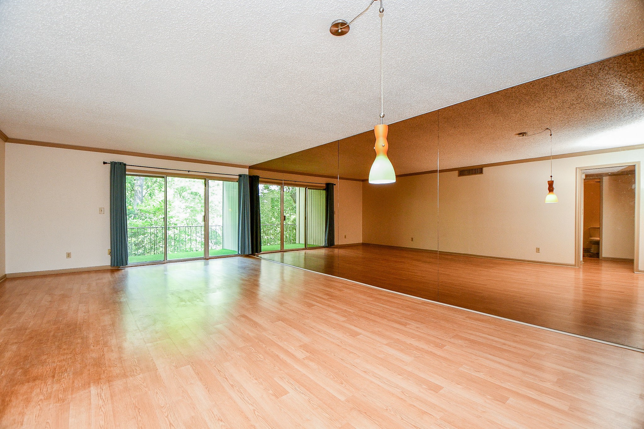 6533 Bayou Glen Road Houston, TX 77057 - Photo 7 of 19 a view of empty room with wooden floor and fan